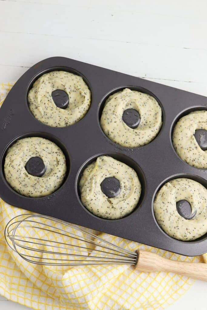 lemon poppyseed donuts in pan, before bake